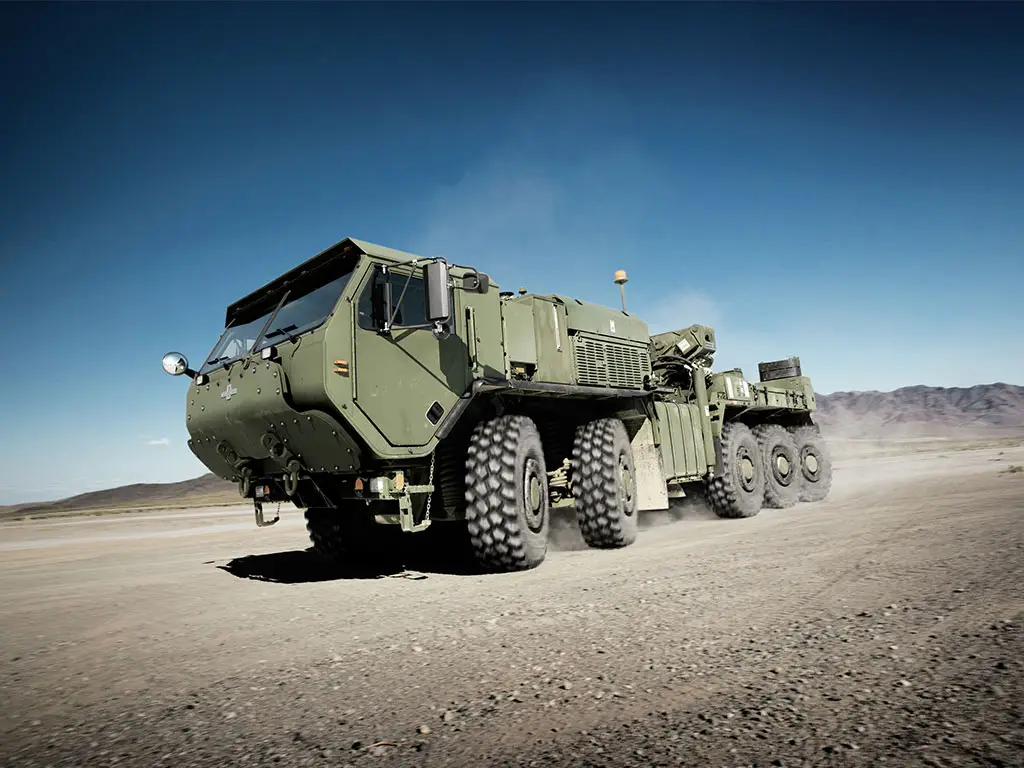 LVSR Wrecker on a dusty gravel road.